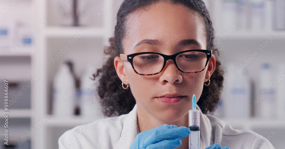 Wall mural lets get testing something new. a young scientist using a syringe in a lab.