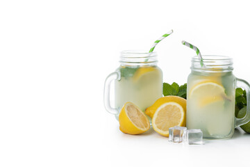 Lemonade drink in a jar glass and ingredients isolated on white background. Copy space