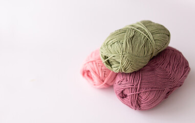 Fototapeta na wymiar Female hobby knitting. Yarn in warm colors. The beginning of the process of knitting a women's sweater.