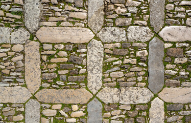 Vertical view on the old stone pavement in Erice Italy that consists of a square in which small...