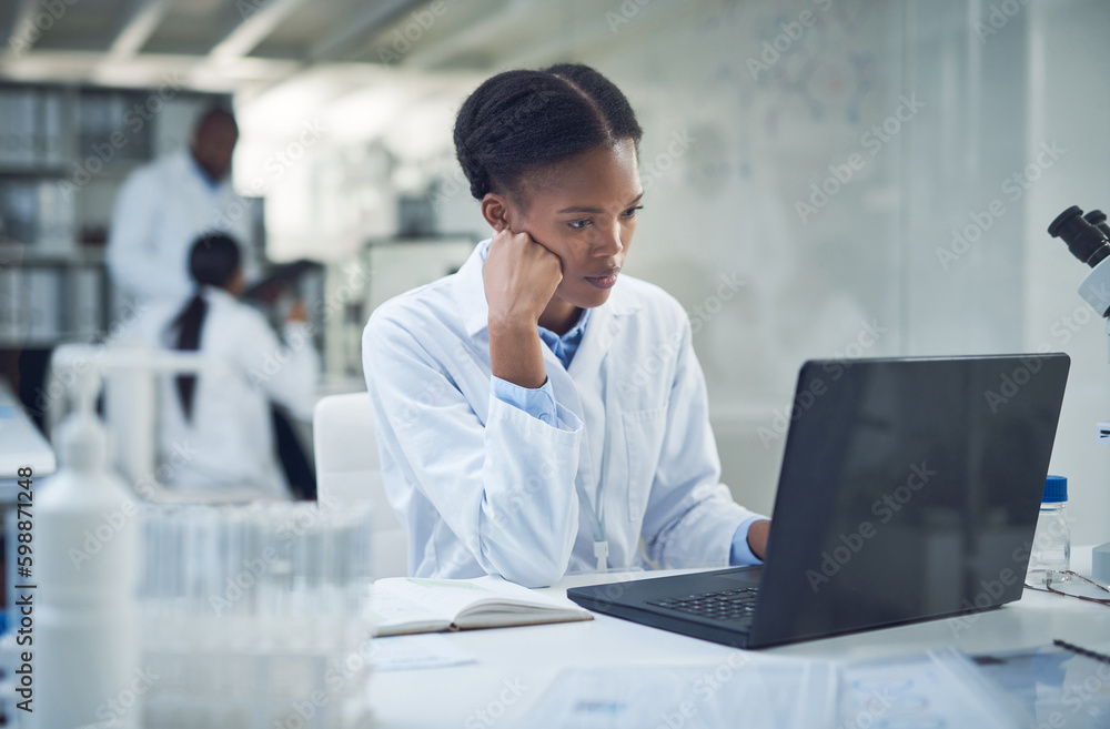 Poster where theres a why theres a way. a young scientist using a laptop while conducting research in a lab