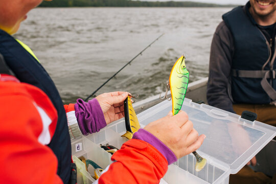 Close-up of person holding fishing lure