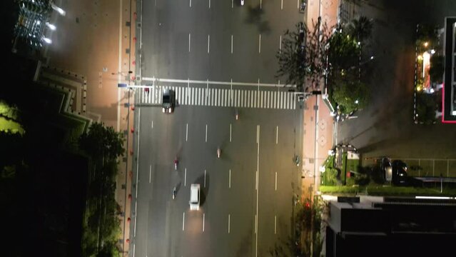 Drone top view of Pahlawan street at night in Surabaya, East Java, Indonesia