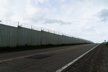 Fototapeta na wymiar Background of prison warfare, barbed wire fence in Phuket Thailand