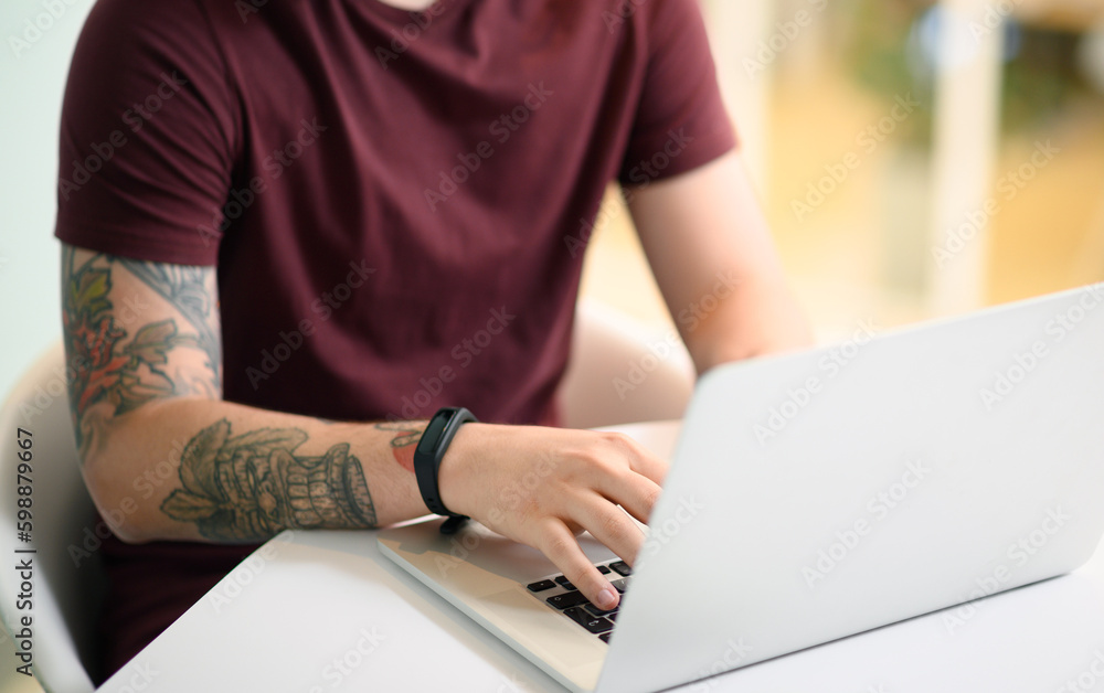 Poster Lets get this productive day started. Closeup shot of an unrecognisable businessman working on a laptop in an office.