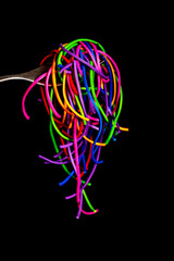 rainbow rubber bands on a fork