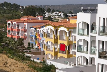 Fototapeta na wymiar Aljezur, Portugal - April 9, 2023: Wonderful landscapes in Portugal. Scenic and coloured view of Algarve Dois, Tourist Resorts in Aljezur. Sunny spring day. Selective focus