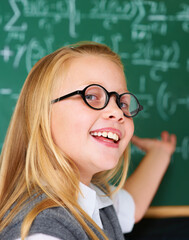 And theres your answer...Portrait of a cute blonde girl directing your attention to the board in...