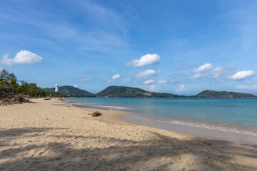Patong Beach Phuket Thailand nice white sandy beach clear blue and turquoise waters and lovely blue skies with Palms tree