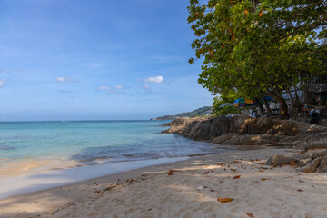 Patong Beach Phuket Thailand nice white sandy beach clear blue and turquoise waters and lovely blue skies with Palms tree sunset sunrise