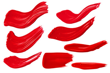 a set of strokes of red paint on a white background.