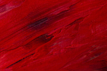 The red strokes are large embossed texture of the paint.