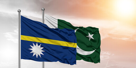 Flags of Pakistan and Nauru friendship flag waving on the sky with beautiful Background.