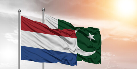 Flags of Pakistan and Netherlands friendship flag waving on the sky with beautiful Background.