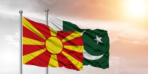 Flags of Pakistan and North Macedonia friendship flag waving on the sky with beautiful Background.