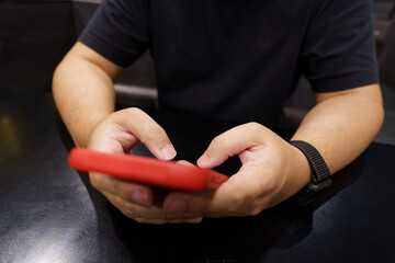 Man playing game on mobile phone. gamer boy playing video games holding Smartphone working mobile devices. cell telephone technology e-commerce concept.