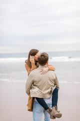 Fototapeta premium A magical moment captured: A couple gets engaged on a California beach