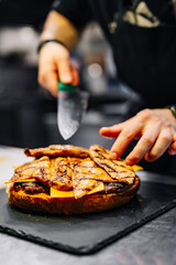 chef hand cooking big large cheese burger on restaurant kitchen. step by step