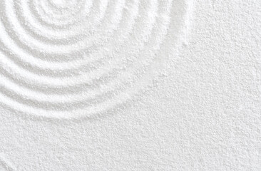 Sand texture with simple spiritual patterns,Japanese Zen Garden with concentric circles and parallel lines on  white sandy surface background,Harmony,Meditation,Zen like concept