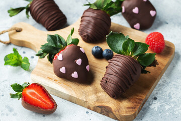 Gourmet chocolate covered strawberries on the light background