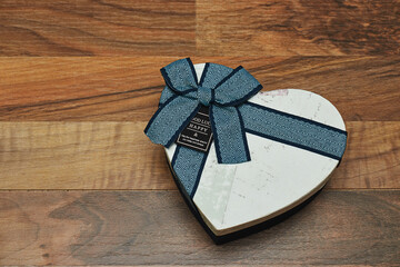closed heart shaped box on wood table