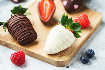 Gourmet chocolate covered strawberries on the light background