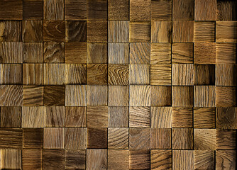 Natural wooden background of small square brown wooden boards, parquet, close-up. The backdrop. Copy space