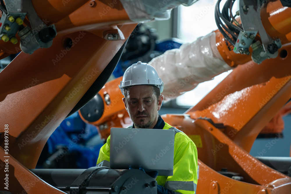 Aufkleber Engineer and mechanic worker checking and maintain industrial robot arm controller inside the factory.