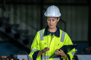 Fototapeta premium Engineer working and programming robotic arm in production plant factory,Modern machine automatic manufacturing industry concept.