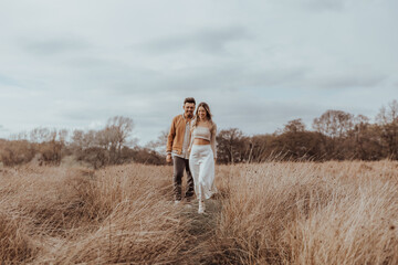 happy couple in the park on a beautiful sunny day