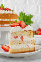 Strawberry cake, vanilla sponge cake with cream cheese and fresh strawberries. Summer cake. Selective focus.