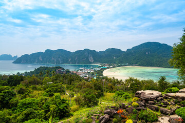 Fototapeta Aerial view of Ko Phi Phi islands, Thailand. Lookout from the viewpoint to tropical island, beach and ocean with long tail boats. Exotic nature, summer weather. obraz