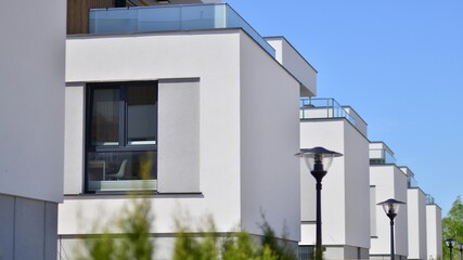 Terraced family homes in newly developed housing estate. The real estate market in the suburbs. New...
