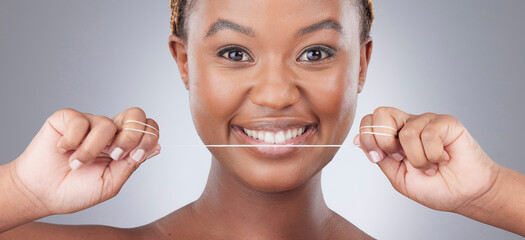 Flossing is so effective, it might change your taste. Studio shot of an attractive young woman...