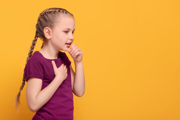 Girl coughing on orange background, space for text. Sore throat