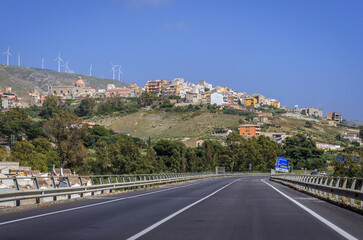 Fototapeta na wymiar Road SS115, view with Siculiana town on background, Sicily Island, Italy