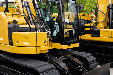 Fleet of yellow construction machines.