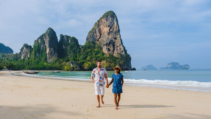 Fototapeta premium A couple of men and women at Railay Beach Krabi Thailand, the tropical beach of Railay Krabi
