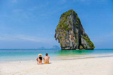 Fototapeta na wymiar A couple of men and women at Railay Beach Krabi Thailand, the tropical beach of Railay Krabi