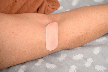 nurse taking blood sample at home