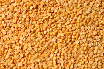 Dry organic lentils or chana channa dal top view background or texture. Healthy spices, nuts, seeds...