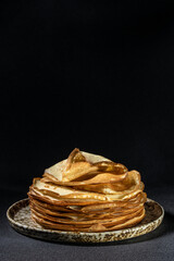 Crepes on plate. Homemade thin fresh crepes for breakfast or dessert. vertical image. place for text