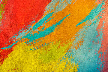 A fragment of colorful graffiti painted on a wall. Abstract urban background. Spray painting art.