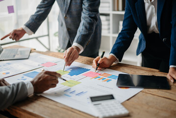 Business People Planning Strategy Analysis Office Concept. writing notes about sticky notes Laptop,tablet  Planning and Brainstorming Strategies