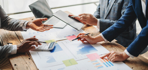 Business People Talking Discussing with financial document data charts and graphs Team business...