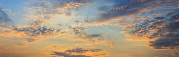 clouds and orange sky,Real amazing panoramic sunrise or sunset sky with gentle colorful clouds. Long panorama, crop it