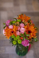 Bouquet with gerberas and other flowers in a vase