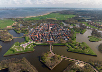 Naarden is a charming town in the Netherlands known for its well-preserved star-shaped fortress,...