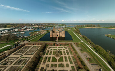 Muiden Castle in Netherlands. Medieval fortress surrounded by a moat. There is on a bit island on the Marermeer.