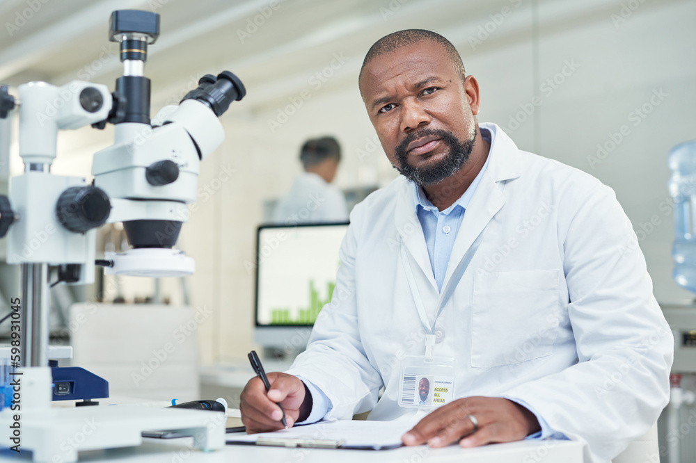 Poster got a question science will answer it. portrait of a mature scientist working in a lab.
